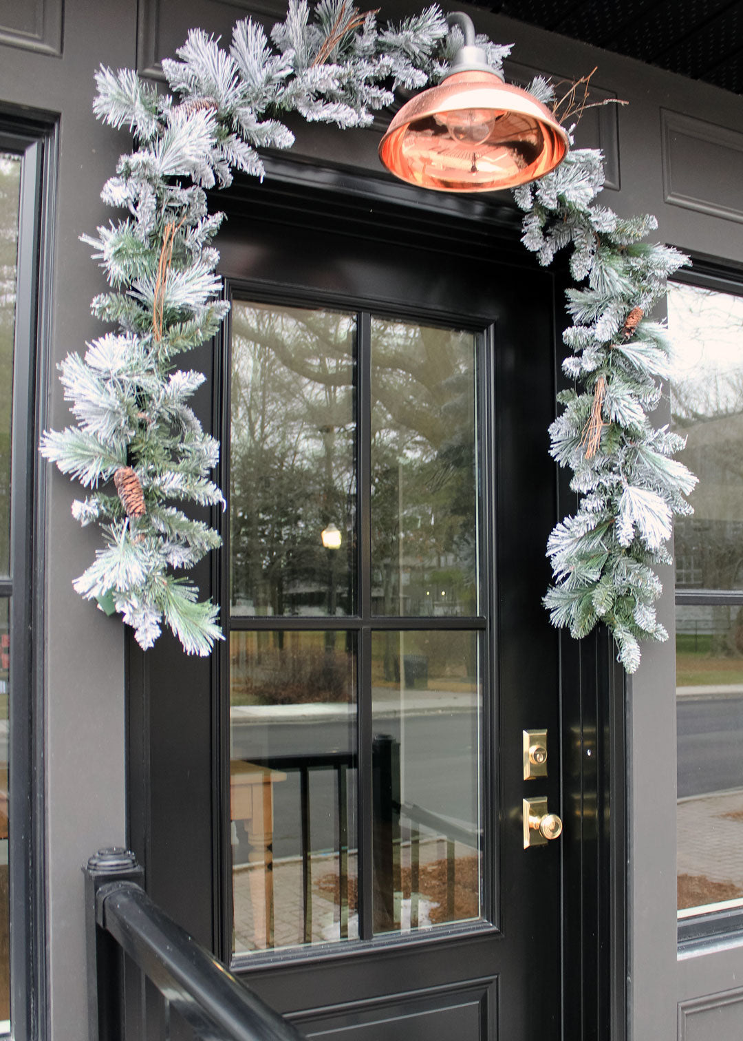 black front door fisher design company storefront store with Nostalgic brass Door Hardware