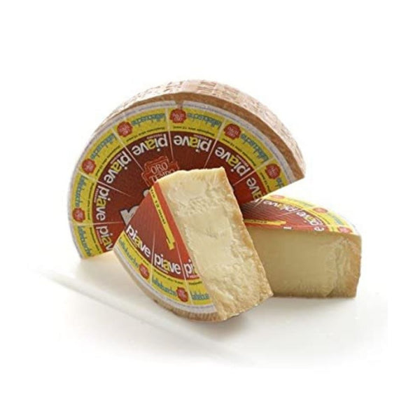 https://cdn.shopify.com/s/files/1/0429/0985/9995/products/gusto-grocery-piave-vecchio-dop-cheese-1-lb-shop-online_grande.jpg?v=1639955775