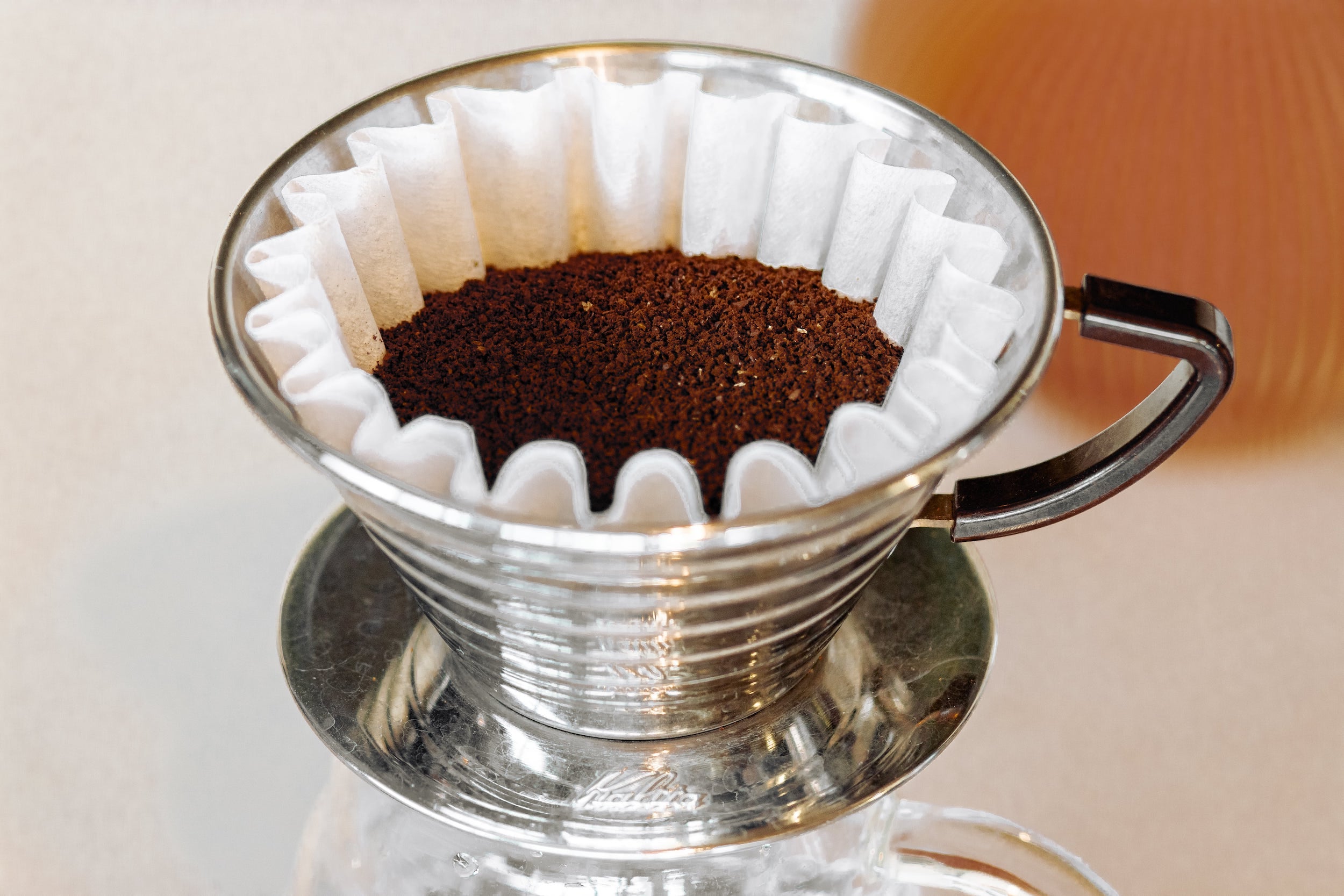 Freshly ground coffee in a Kalita brewer