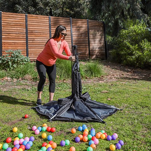 mom setting up playpen