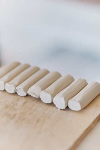 Handles prepared and lined-up on workbench by Sofie Neuendorf.