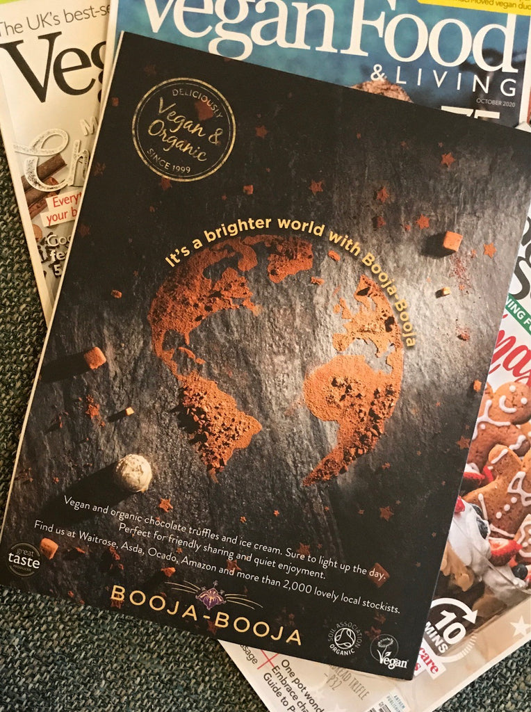 Booja-Booja advertisement from January 2021 edition of Vegan Food & Living magazine, featuring a cocoa powder Earth.
