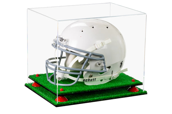 A football helmet sits on a turf base inside a clear acrylic display case manufactured by Better Display Cases