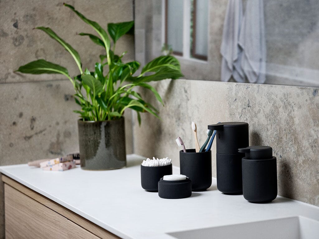 Black UME bath accessories on bathroom counter