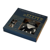 The Keeper bear paw design retail box with windows showing AirTag holder and clasp