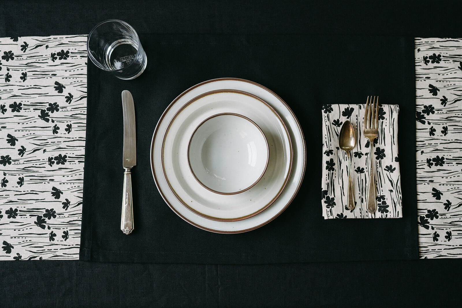 Black and white floral linen table runner with place setting