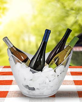 Bucket of ice with wine on patio table