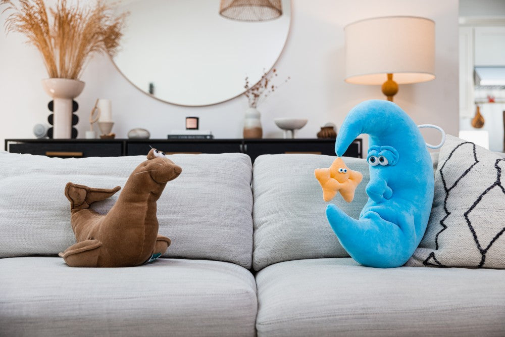 Funny plushies on a couch