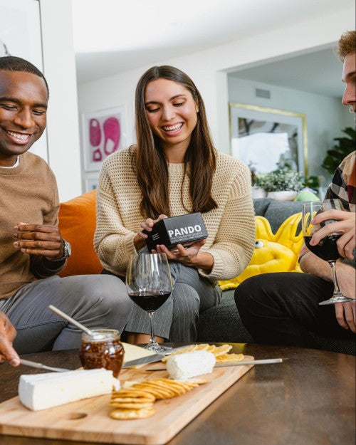 Group of people playing games and eating charcuterie