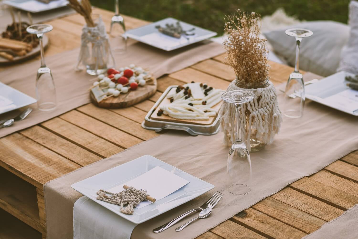 Thanksgiving table decor with tan table runner and rustic centerpiece