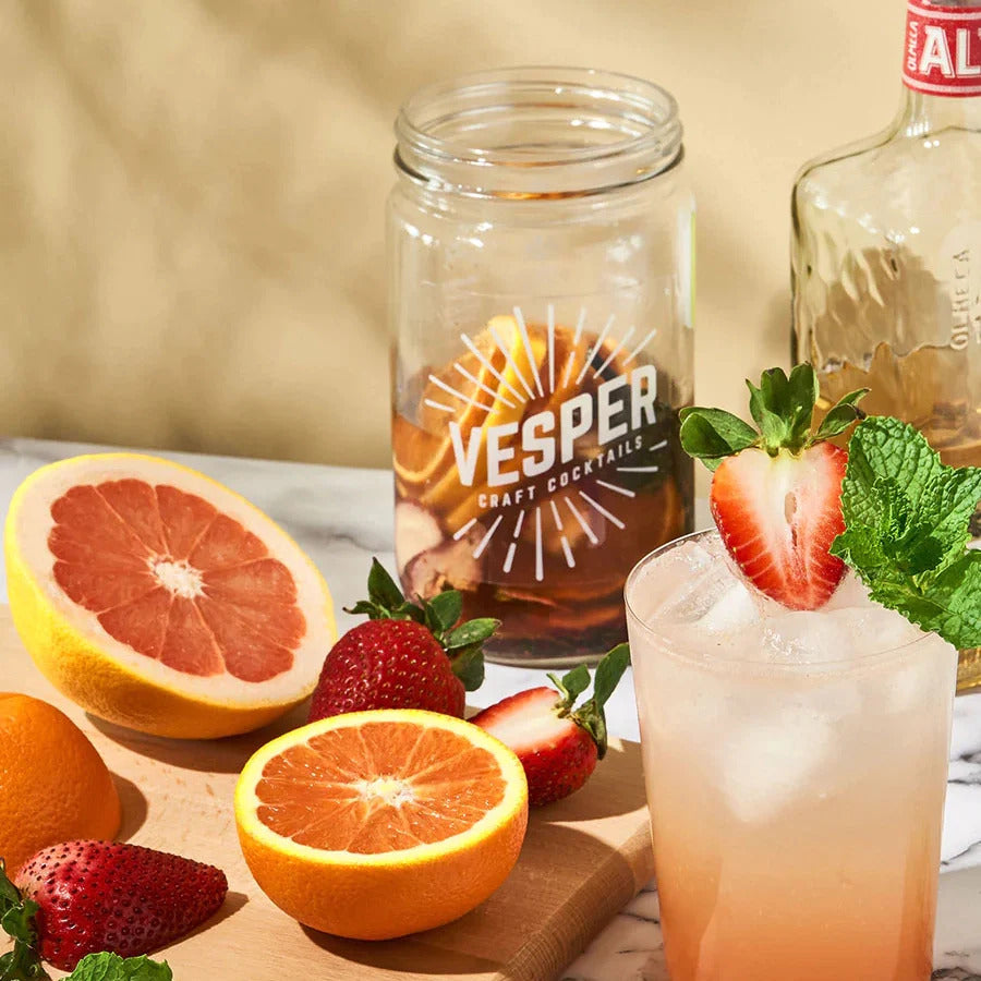 Jar of Vesper infused liquor, fruit, and cocktail