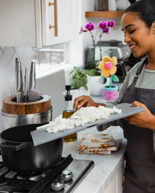 Woman cooking onions