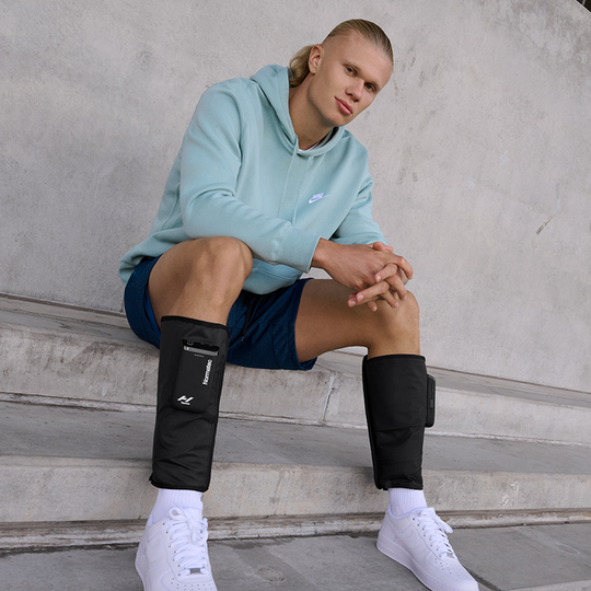 Haaland wearing normatec compression