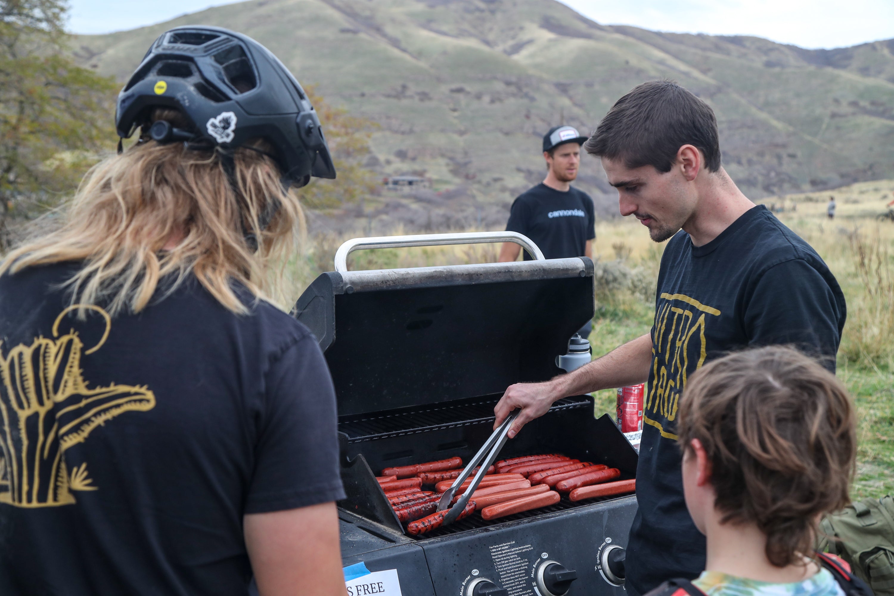 Virgil Lund cooking dogs on the grille