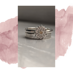 Memor Jewellery recycled sterling silver flower stackable ring and plain textured silver band.