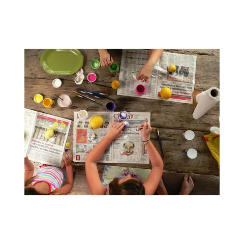 Children crafting around a table