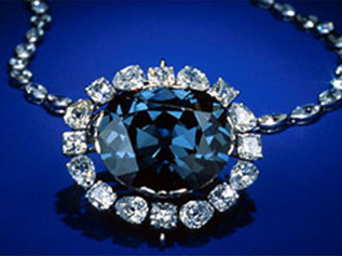 The Hope Diamond necklace on a blue background
