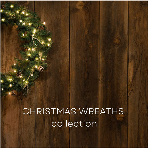 Pre-lit Christmas wreath on a dark wooden background