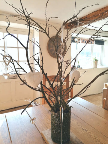 Branch display with hanging heart tree decorations for Spring home decor