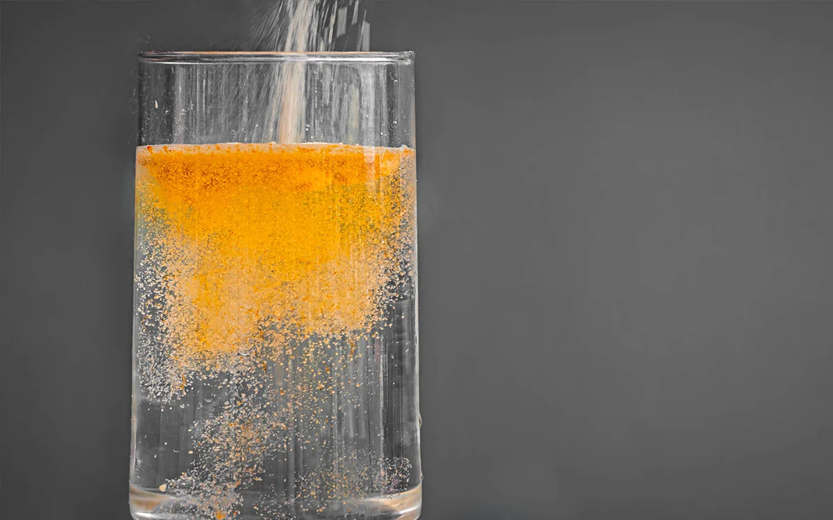 Electrolyte powder poured into a glass of water