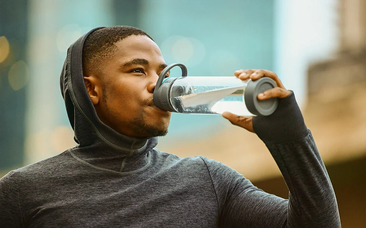 Man Drinking Water From Bottle