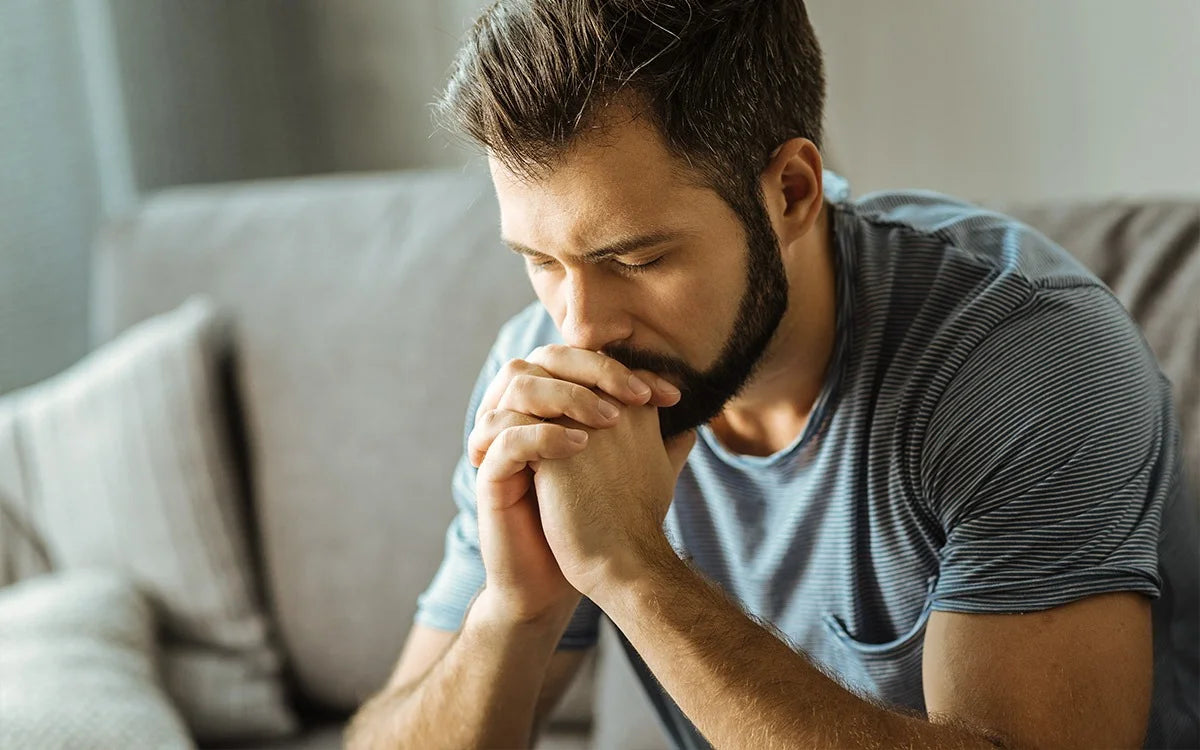 Stressed man looking unhappy