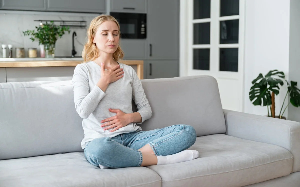 Woman Meditating On Couch