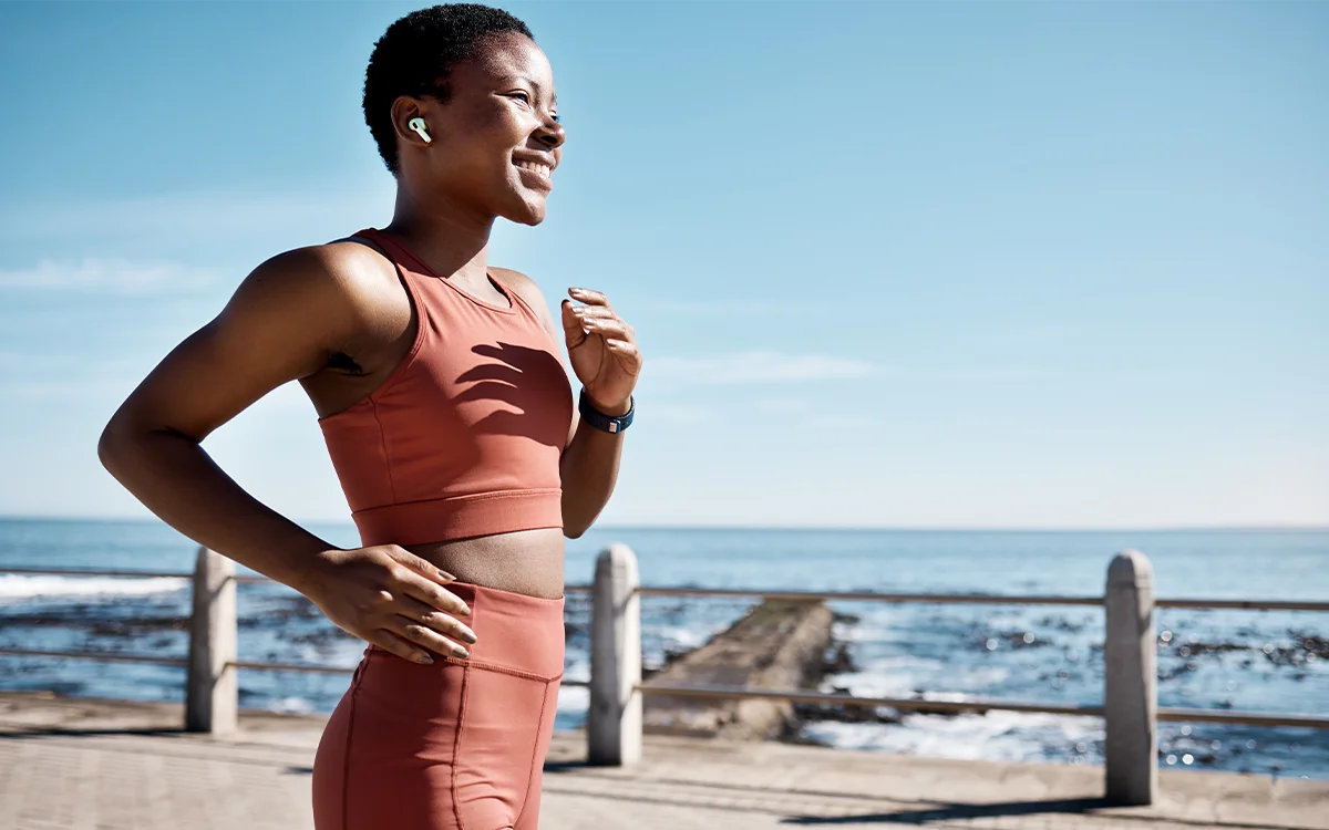 Woman Running and Smiling