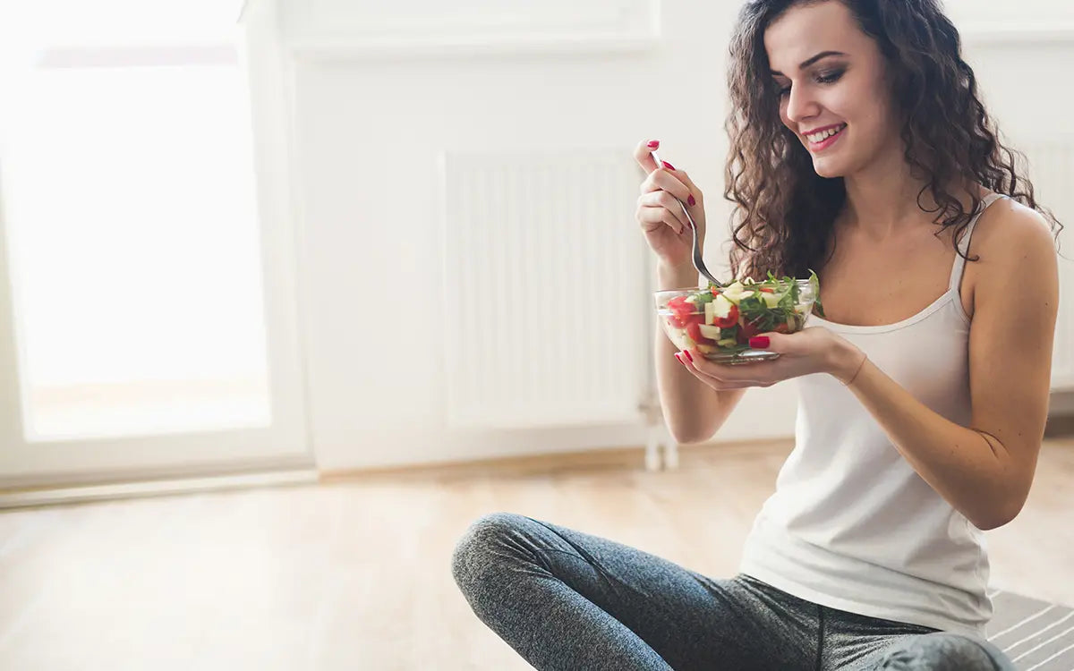 healthy woman sitting and eating