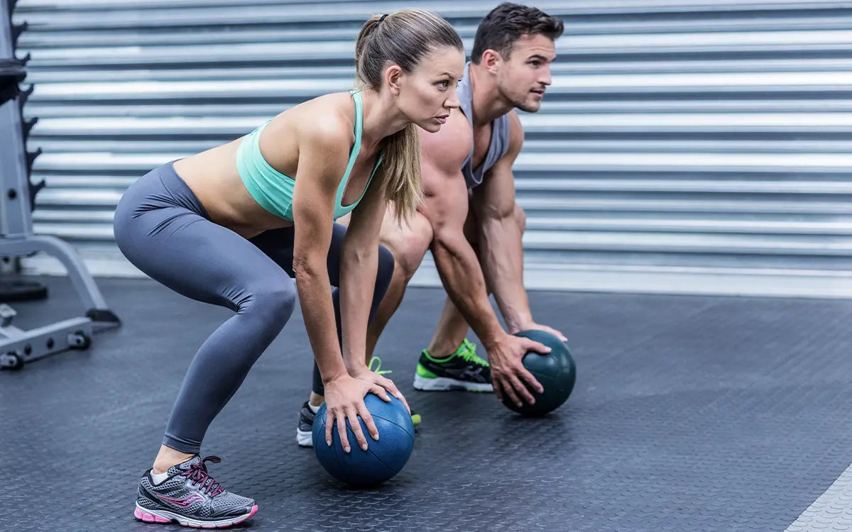 man and woman working out together