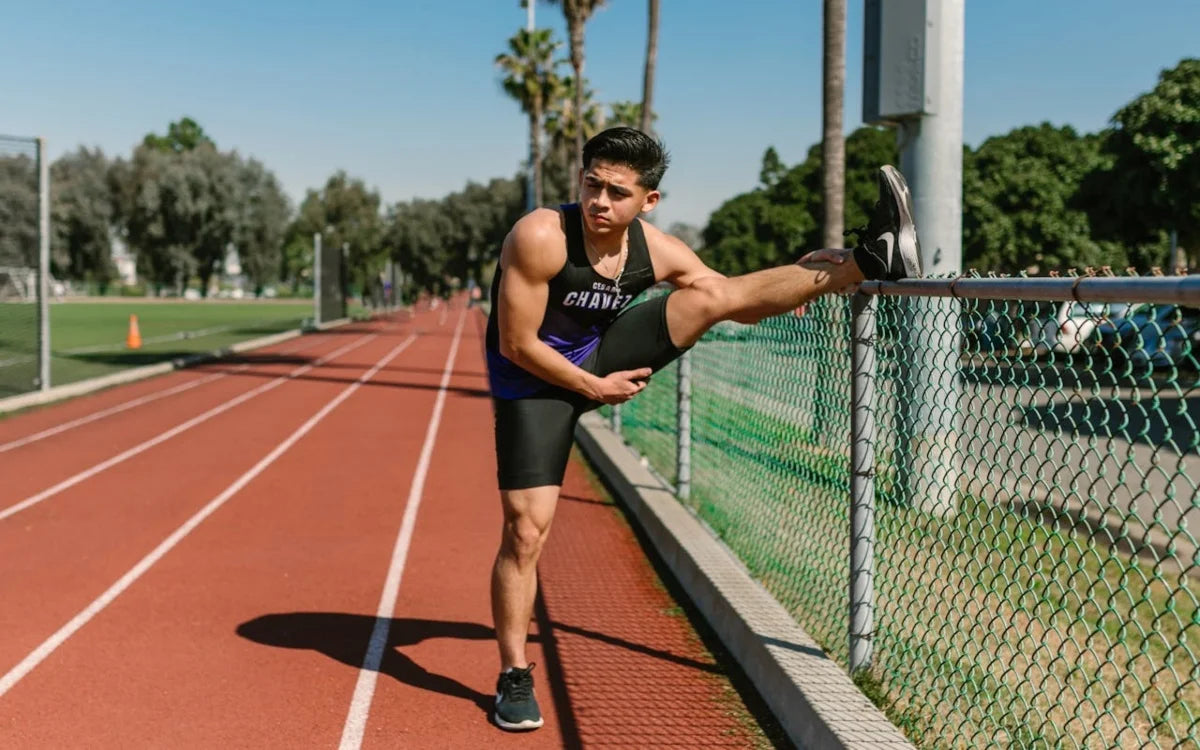 track athlete stretching legs