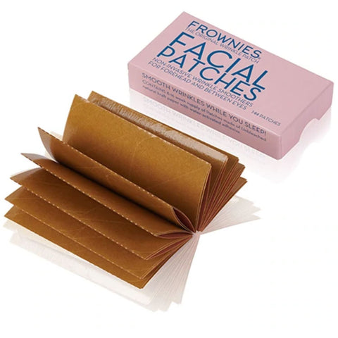 Pink box with several sheets of brown Frownies Forehead and Between Eyes Facial Patches on a white background, Made in the USA