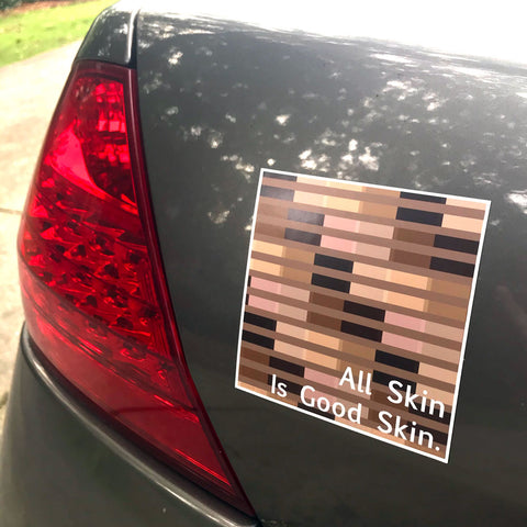 All Skin Is Good Skin Equality vinyl magnet for car by Sunny Day Designs. A black lives matter inspired car magnet is shown that includes overlapping equal signs in various skin tone shades, with the words "All Skin Is Good Skin" in white. Shown on the back of a car.