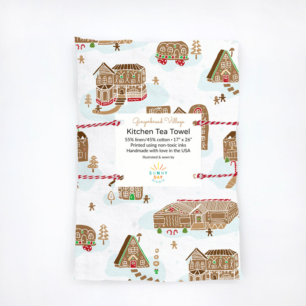 https://cdn.shopify.com/s/files/1/0430/4057/1556/products/GingerbreadVillageTeaTowel-Packaged-MU-SunnyDayDesigns-HighRes_1024x1024.jpg?v=1658107122