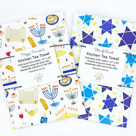 Jewish Kitchen Tea Towel set of 2, Happy Hanukkah printed dish towel and Star of David printed tea towel by Sunny Day Designs. Made in the USA from linen/cotton fabric