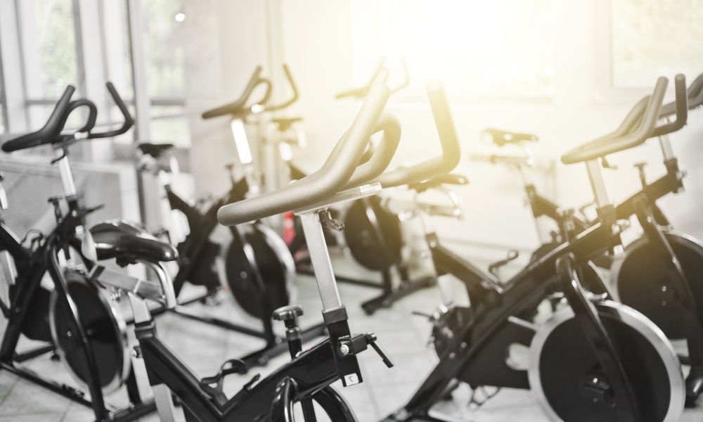 6 Killer Exercise Bike Workouts From the Pros