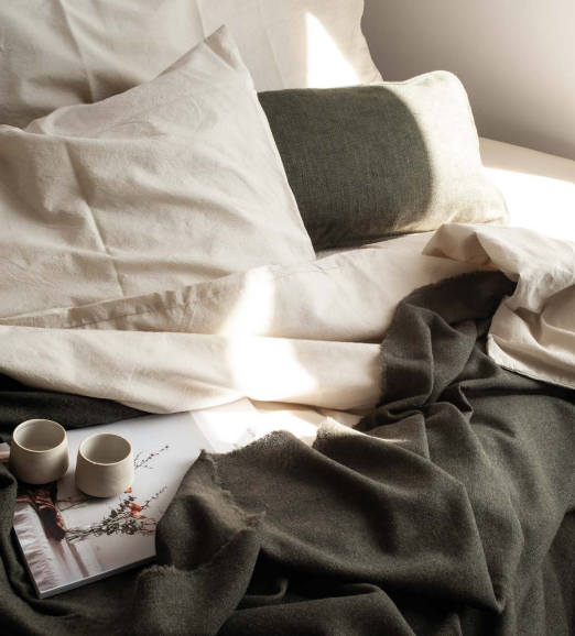 Bedding on a mattress showing a relaxed bedroom scene