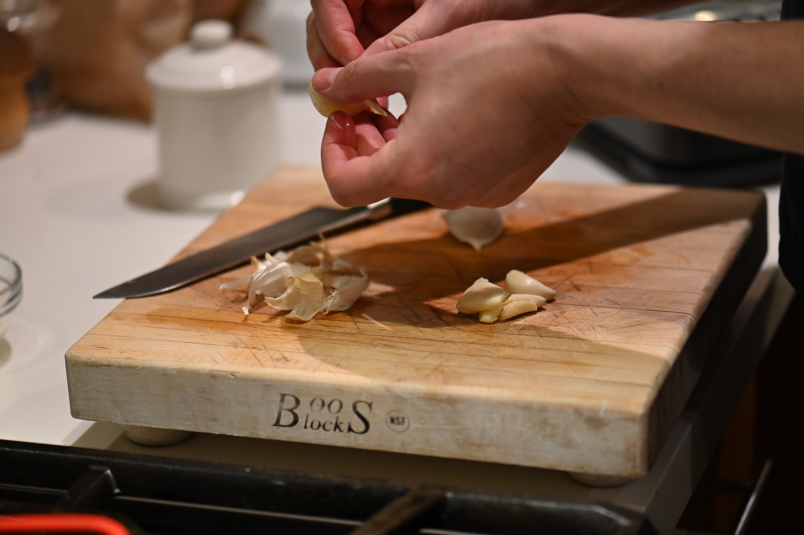 hands dicing garlic