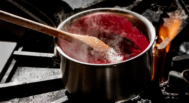 pink risotto with beet juice in pan on stovetop