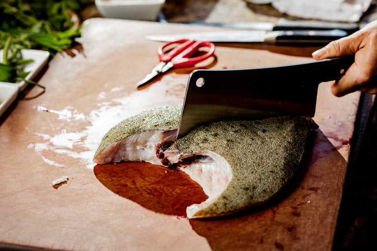 Cleaver cutting Turbot for cooking