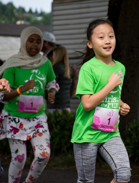 Two girls running