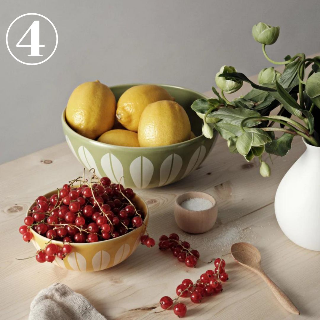 Table featuring Arne Clausen Lotus pattern bowls