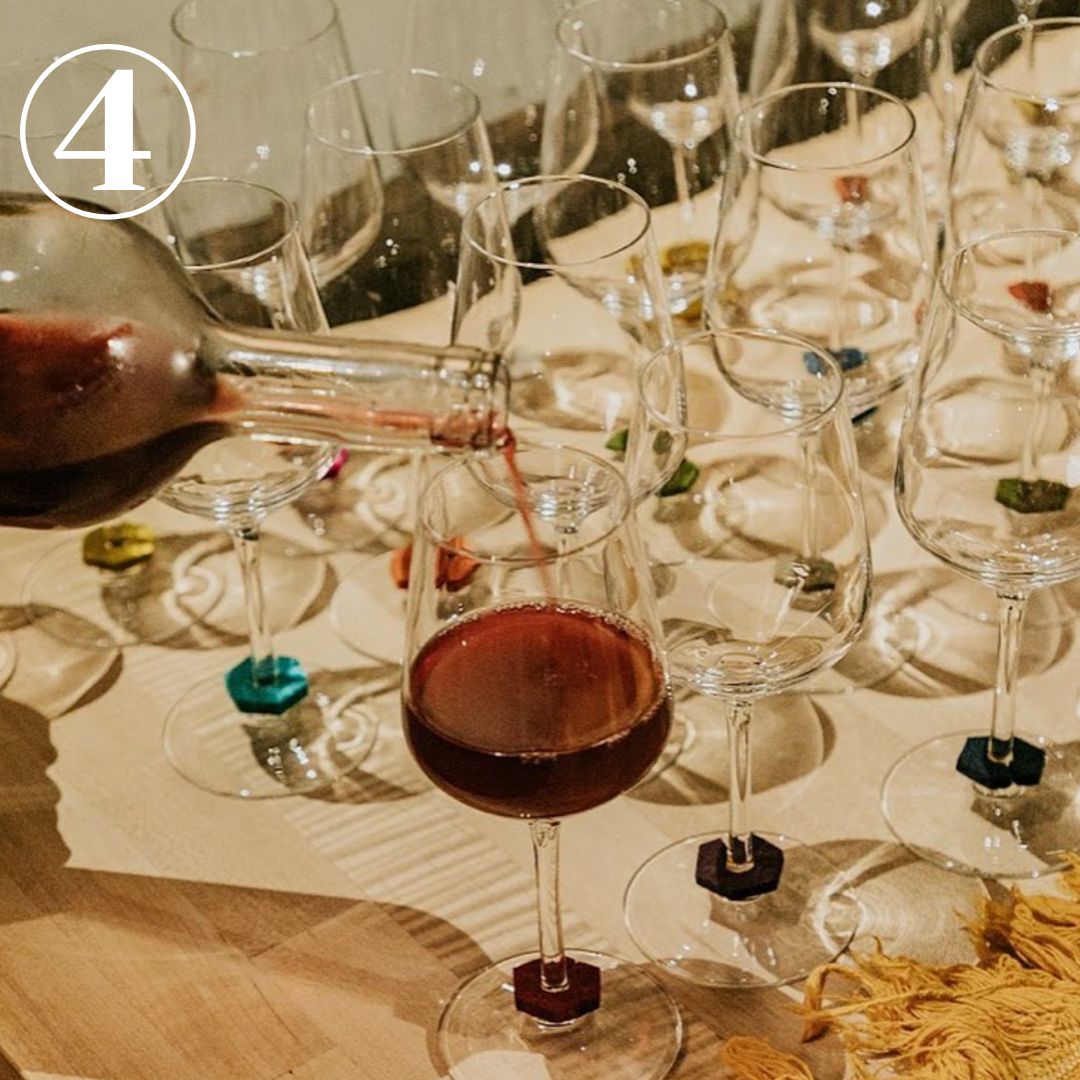 Pouring Wine into a table of wine glasses with Win-O's