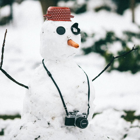 Snowman with a camera