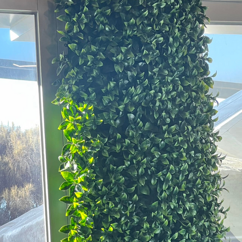 Long Row of Artificial grass panel In cafe