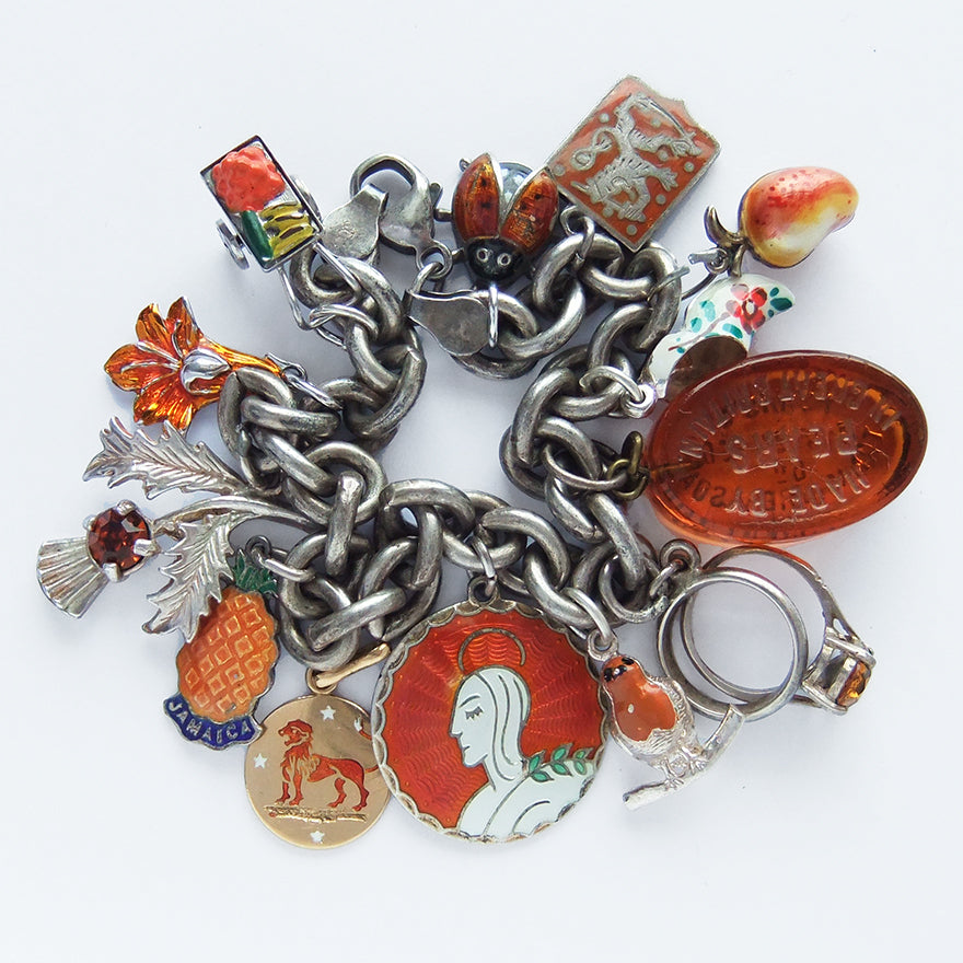 Charm bracelet with antique and vintage enamel and crystal orange charms | Silver Star Charms