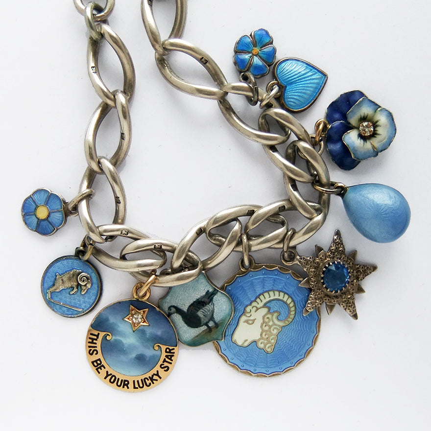 Charm bracelet with antique and vintage enamel and crystal blue charms | Silver Star Charms