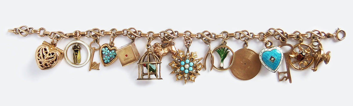 Vintage and antique gold and enamel charm bracelet