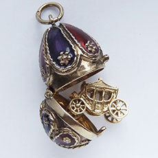 Faberge style Easter egg charm opens to coach
