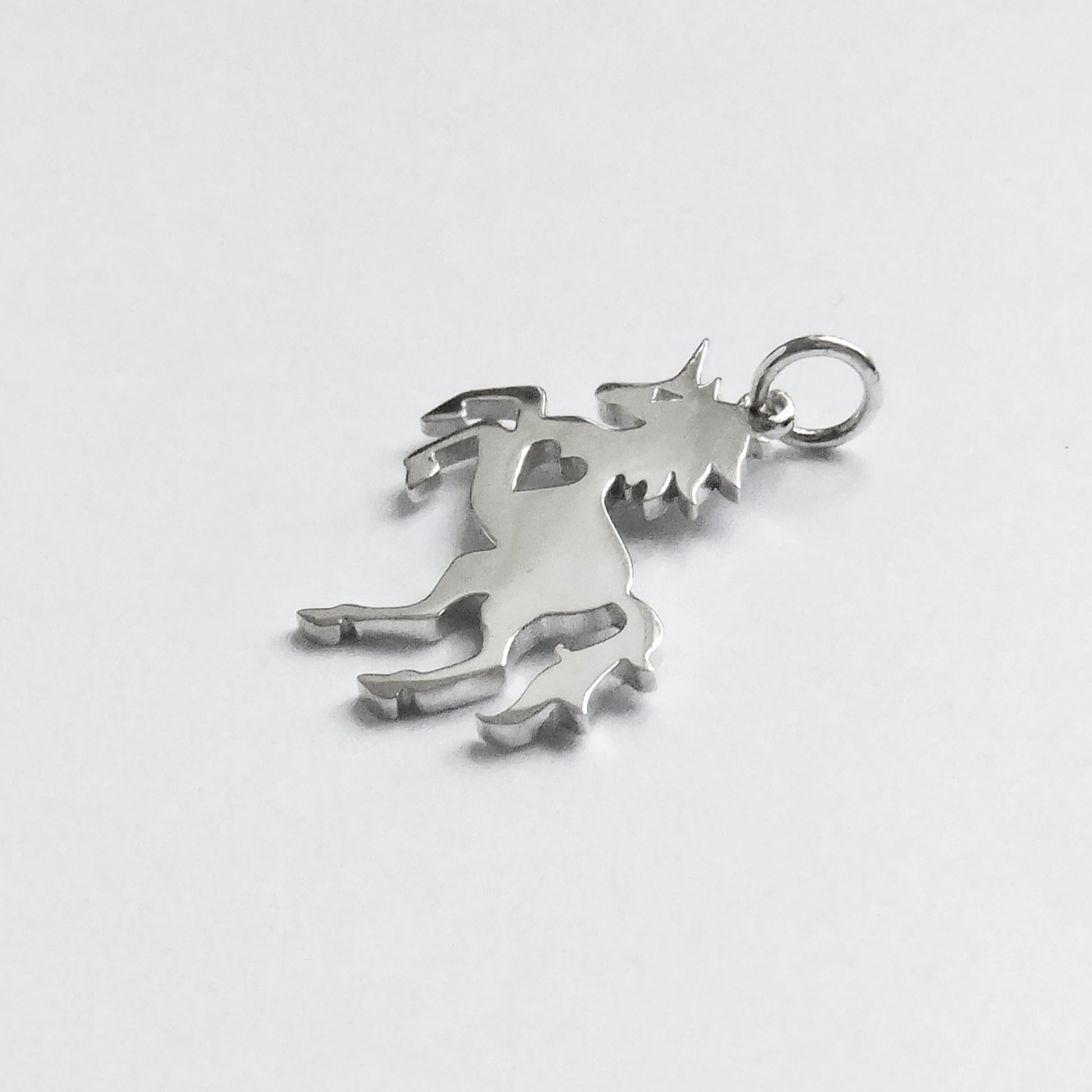 unicorn silhouette with heart charm